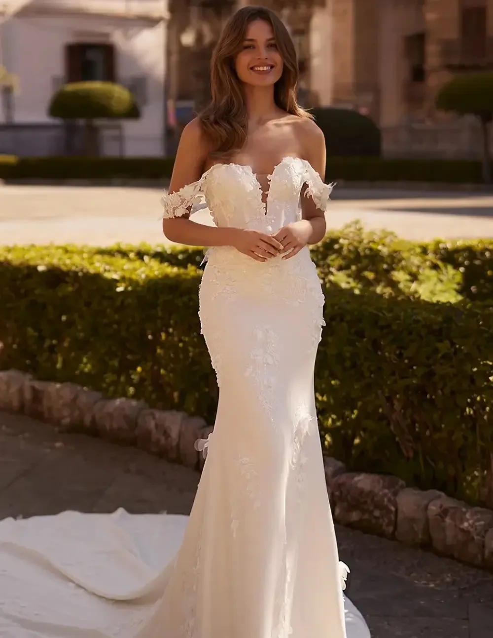 Model wearing a white Aria Bride gown
