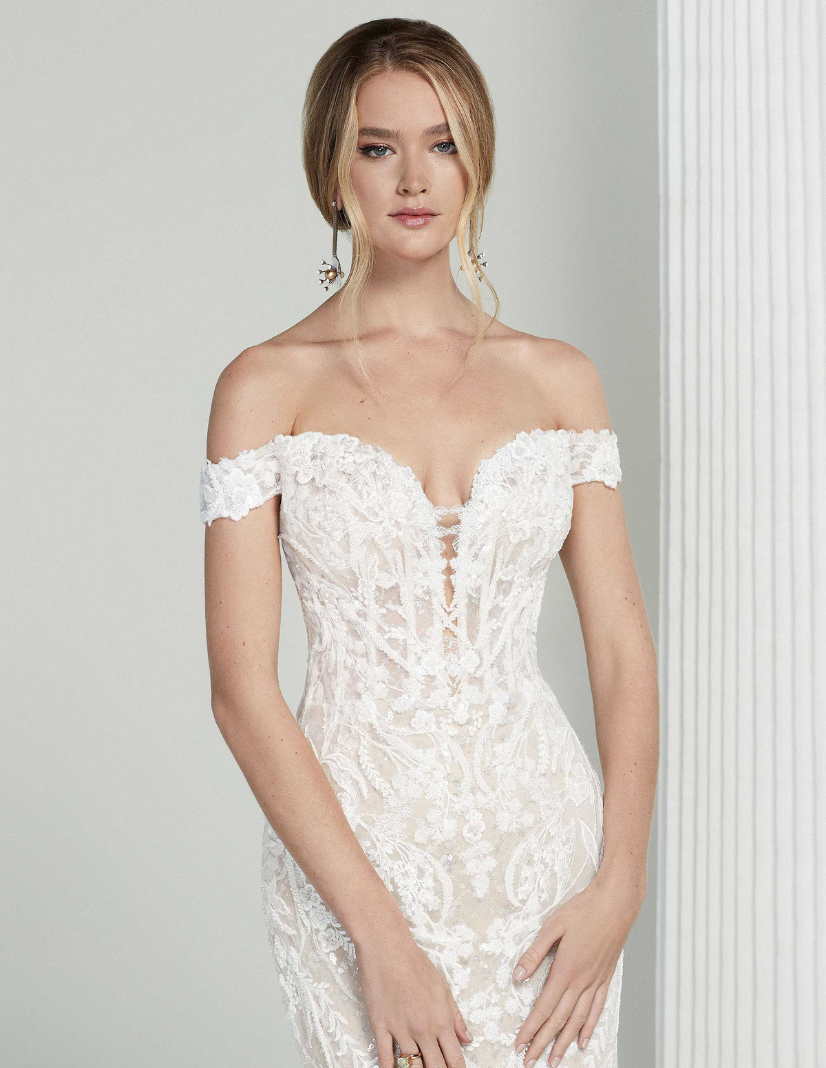 Model wearing a white Blue by Enzoani bridal gown